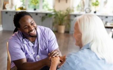 Medical assistant gaining clinical experience with senior patient